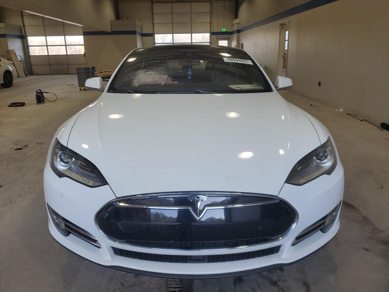 2015 Tesla Model S VIN: 5YJSA1E4XFF110720 Lot: 48694825