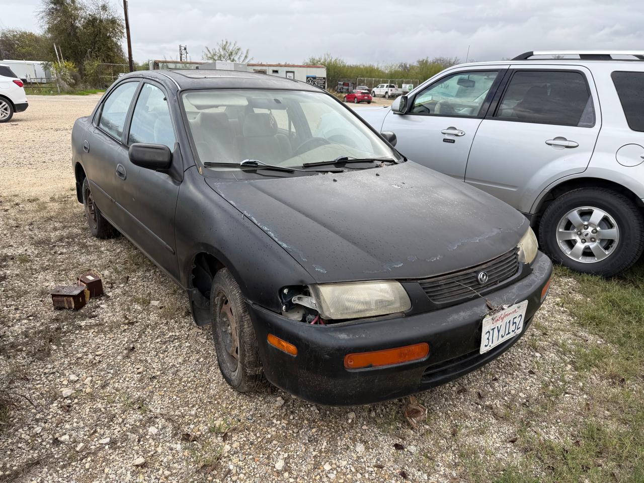 1995 Mazda Protege Dx VIN: JM1BA1419S0100163 Lot: 85915754