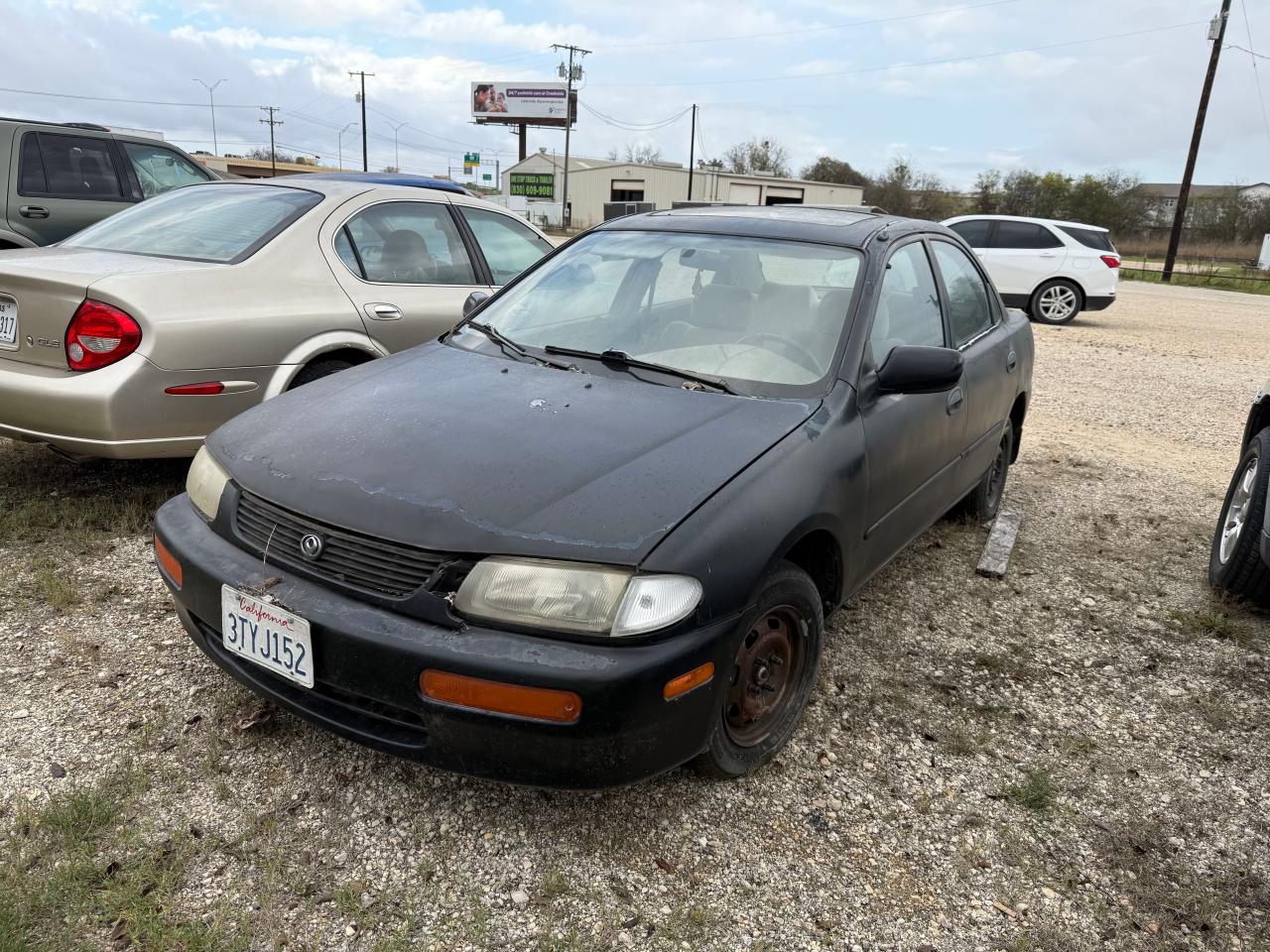 1995 Mazda Protege Dx VIN: JM1BA1419S0100163 Lot: 85915754